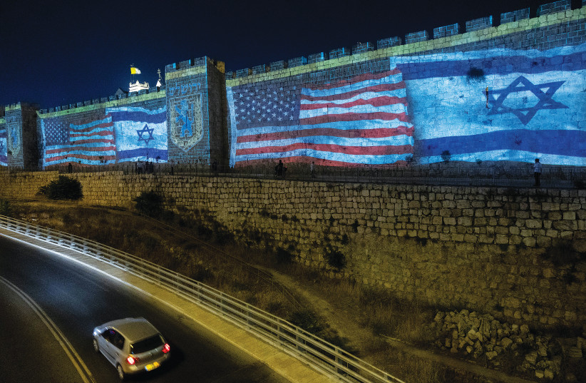  THE US and Israeli flags are screened on the walls of Jerusalem’s Old City, welcoming US President Joe Biden, on Wednesday night. (photo credit: YONATAN SINDEL/FLASH90)