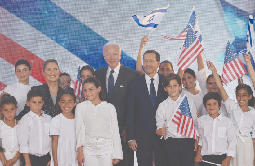  US PRESIDENT Joe Biden is greeted by President Isaac Herzog and Israeli children at the President’s Residence yesterday. (photo credit: Yonatan Zindel/Flash90)
