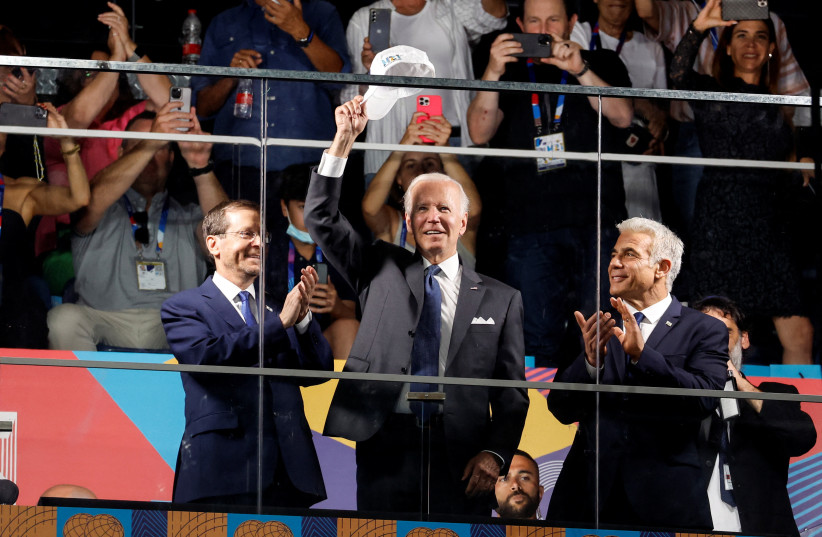  US President Joe Biden, Israel Prime Minister Yair Lapid and Israel President Isaac Herzog attend the the opening ceremony of the Maccabiah in Jerusalem July 14, 2022 (credit: REUTERS/AMMAR AWAD)