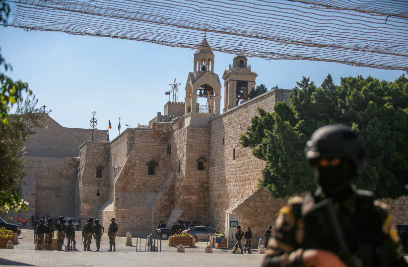  Palestinian security forces guard outside the Church of Nativity in the West Bank town of Bethlehem on July 14, 2022, before the visit of US president Joe Biden. (credit: FLASH90)