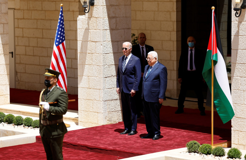  Palestinian President Mahmoud Abbas welcomes US President Joe Biden in Bethlehem in the Israeli-occupied West Bank July 15, 2022. (photo credit: REUTERS/MOHAMAD TOROKMAN)