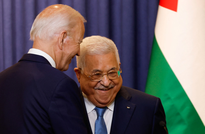  Palestinian President Mahmoud Abbas and US President Joe Biden react after a statement, in Bethlehem in the West Bank July 15, 2022. (credit: REUTERS/MOHAMAD TOROKMAN)