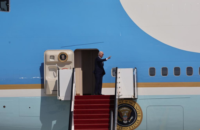  US President Joe Biden waves as he boards Air Force One to head over to Saudi Arabia as he completes his visit to Israel. (credit: YONATAN SINDEL/FLASH90)