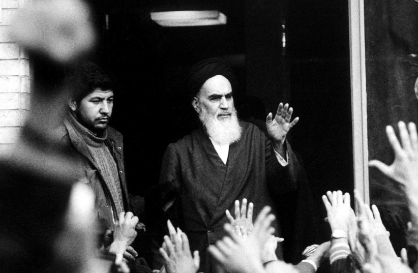  THE LATE leader and founder of the Islamic revolution Ayatollah Khomeini speaks in Tehran during the revolution, in 1979. The landing of Khomeini at Tehran airport on his return from exile has failed to pacify and transition from revolution to state, says the writer.  (photo credit: REUTERS)