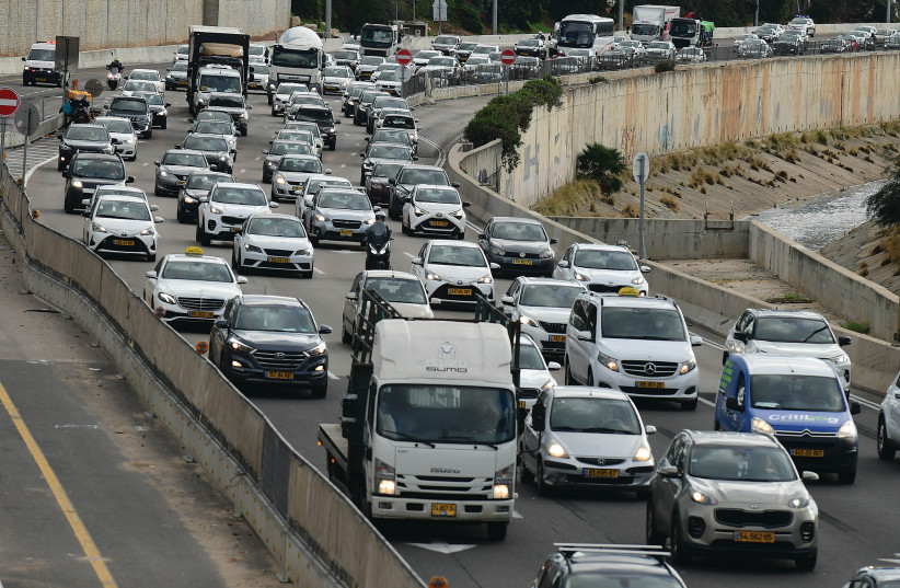  HEAVY TRAFFIC moves slowly on the Ayalon Highway. The traffic jams that afflict greater Tel Aviv have become one of Israel’s most acute problems, says the writer. (credit: TOMER NEUBERG/FLASH90)