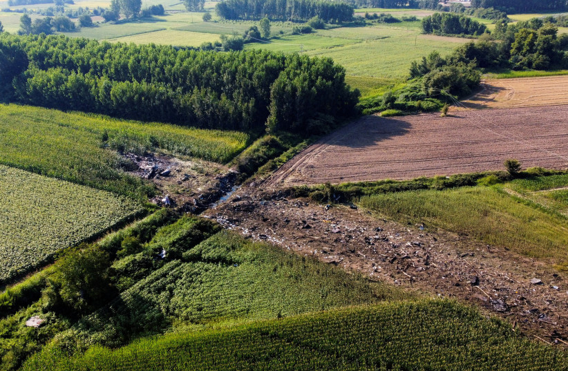 A view of the crash site of an Antonov An-12 cargo plane owned by a Ukrainian company, near Kavala, Greece, July 17, 2022.  (credit: REUTERS/ALKIS KONSTANTINIDIS)