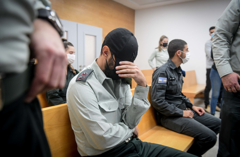  Dan Sharoni, an IDF officer accused of sexual offenses arrives for a court hearing at a military court in HaKirya base, Tel Aviv, December 7, 2021.  (photo credit: AVSHALOM SHOSHONI/FLASH90)
