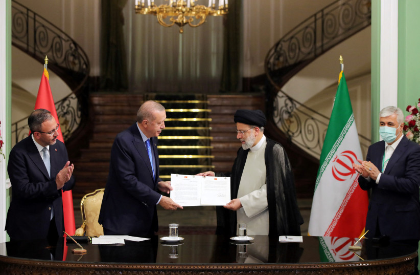  Turkish President Tayyip Erdogan and his Iranian counterpart Ebrahim Raisi attend a signing ceremony in Tehran, Iran July 19, 2022. (credit: Turkish Presidential Press Office/Handout via REUTERS)