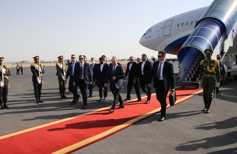 Russian President Vladimir Putin takes part in a welcoming ceremony at an airport upon his arrival in Tehran, Iran July 19, 2022. (photo credit: Sputnik/Konstantin Zavrazhin/Pool via REUTERS)
