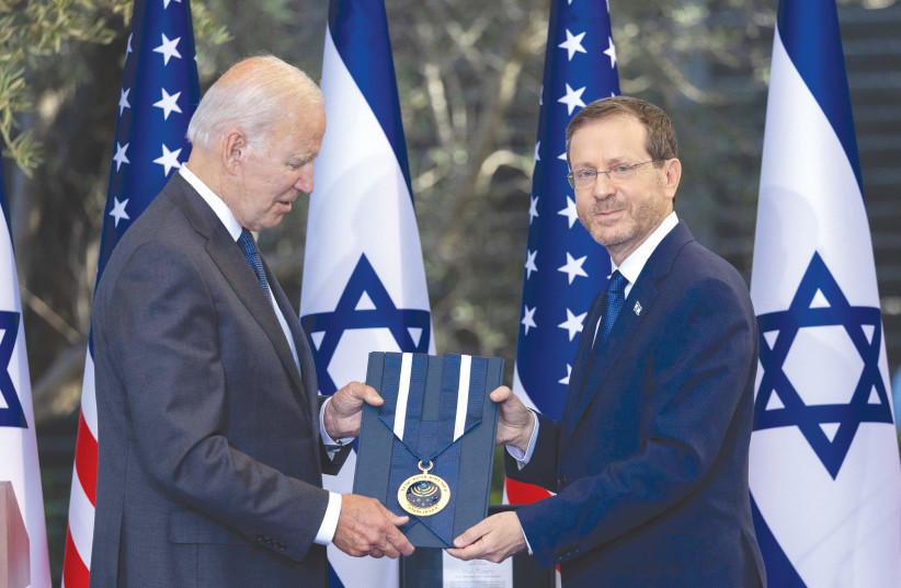  PRESIDENT ISAAC Herzog presents US President Joe Biden with the medal of honor at the President’s Residence in Jerusalem, last week. (photo credit: YONATAN SINDEL/FLASH90)
