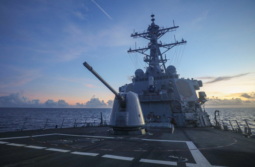 Arleigh Burke-class guided-missile destroyer USS Benfold (DDG 65), forward-deployed to the US 7th Fleet area of operations, conducts underway operations in the South China Sea, in this handout picture released on July 13, 2022.  (credit: US NAVY/HANDOUT VIA REUTERS)