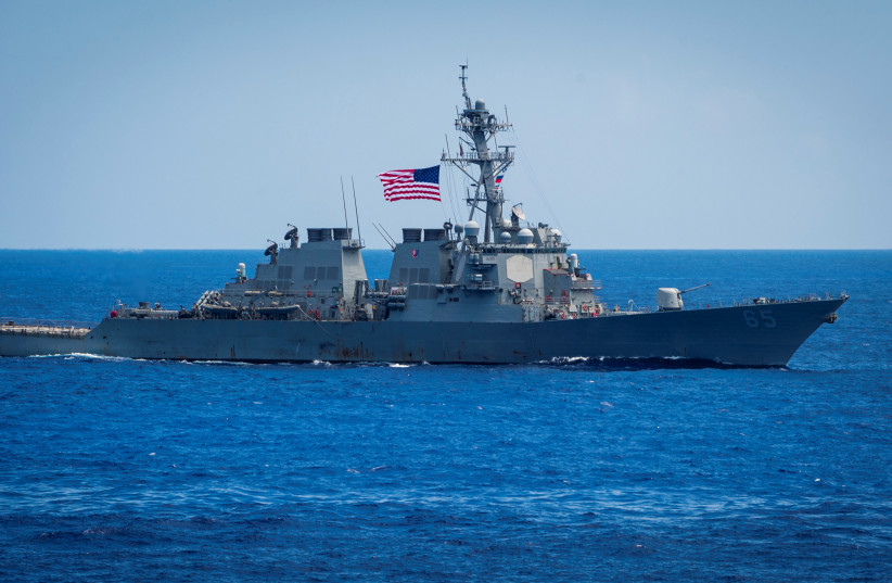  The Arleigh Burke-class guided-missile destroyer USS Benfold sails in formation during exercise Malabar 2018 in Philippine Sea, June 15, 2018. Picture taken on June 15, 2018. (photo credit: SARAH MEYERS/US NAVY HANDOUT VIA REUTERS)