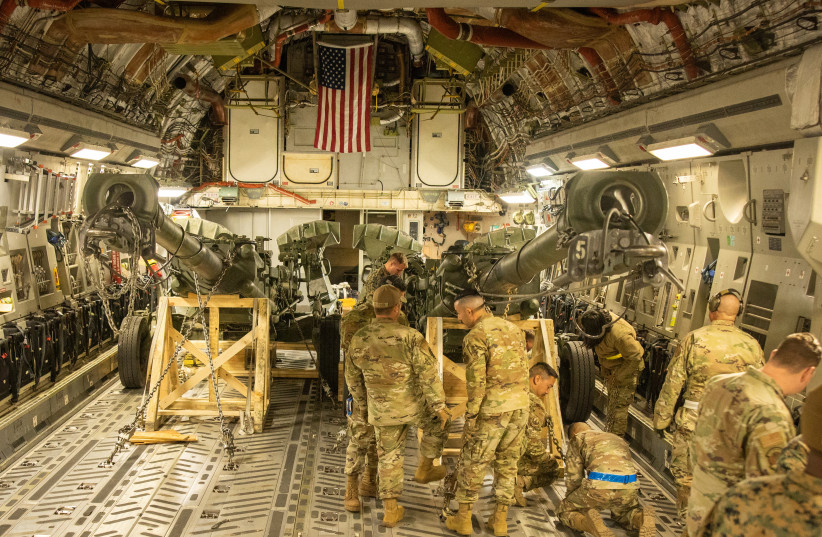 US Marines load an M777 towed 155 mm howitzer into the cargo hold of a US Air Force C-17 Globemaster III transport plane, to be delivered in Europe for Ukrainian forces, at March Air Reserve Base, California, US April 21, 2022.  (credit: US MARINE CORPS/ CPL. AUSTIN FRALEY/HANDOUT VIA REUTERS.)