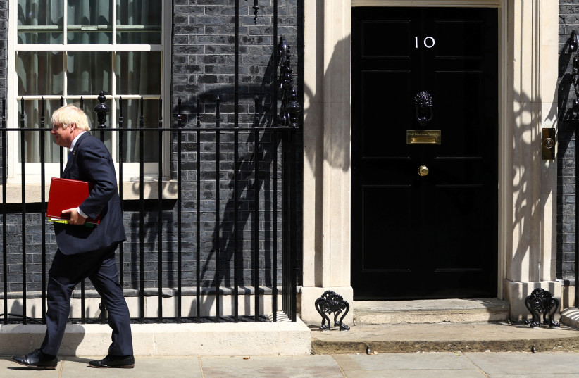  British Prime Minister Boris Johnson walks outside Downing Street in London, Britain, July 20, 2022.  (photo credit: REUTERS/HANNAH MCKAY)