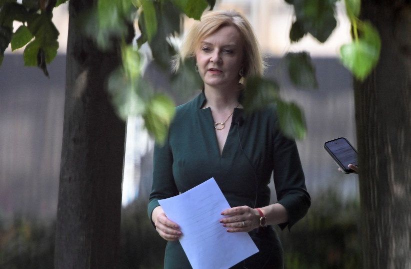 British Foreign Secretary and Conservative leadership candidate Liz Truss reacts near the houses of Parliament, in London, Britain, July 20, 2022. (credit: REUTERS/TOBY MELVILLE)