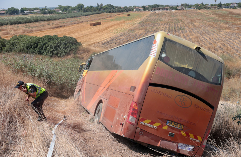  POLICE AT the scene of a bus run off the road at Anava Junction, Road 1, July 18.  (photo credit: YOSSI ALONI/FLASH90)