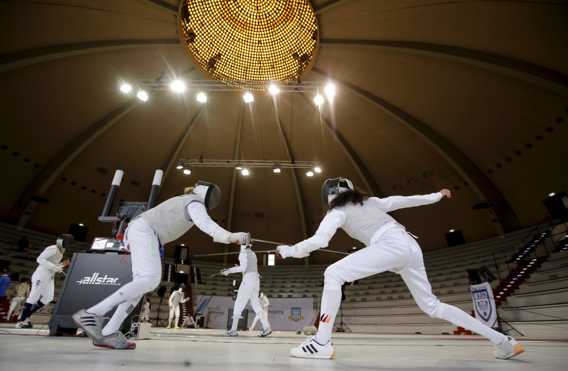 COMPETITORS FROM Ukraine and the US compete during the fencing competition at the 14th European Maccabi Games in 2015 in Berlin. (photo credit: Fabrizio Bensch/Reuters)