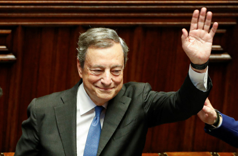  Italy's Prime Minister Mario Draghi waves as he leaves after addressing the lower house of parliament ahead of a vote of confidence for the government after he tendered his resignation last week in the wake of a mutiny by a coalition partner, in Rome, Italy July 21, 2022. (photo credit: REUTERS/REMO CASILLI)