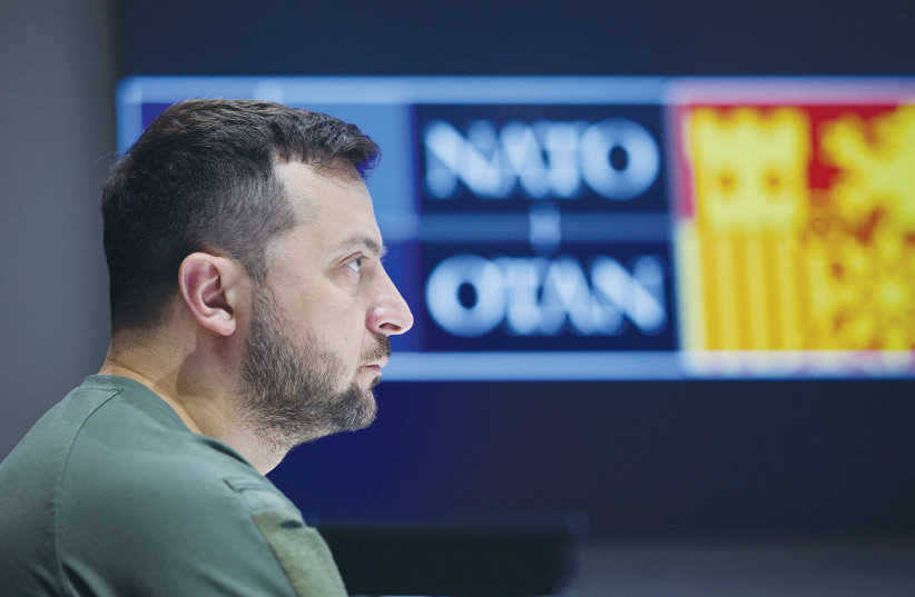  UKRAINE’S PRESIDENT Volodymyr Zelensky attends last month’s NATO summit in Madrid via video link from Kyiv (photo credit: REUTERS)