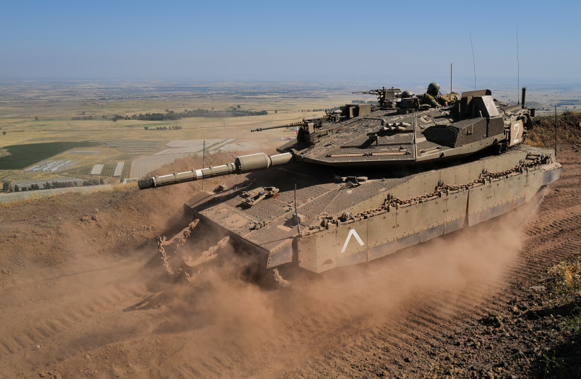  IDF tank soldiers from the 53rd Battalion of the 188th Tank Brigade are on alert in a military outpost overlooking Syrian villages near the Israeli border, southern Golan Heights on May 23, 2022. (credit: MICHAEL GILADI/FLASH90)