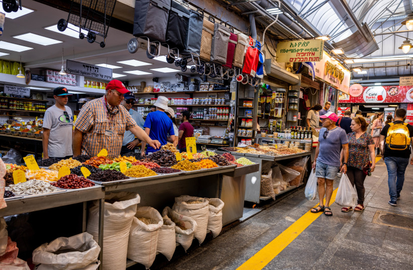  People enjoy at the Mahane Yehuda market in Jerusalem, July 21, 2022. (credit: NATI SHOHAT/FLASH90)