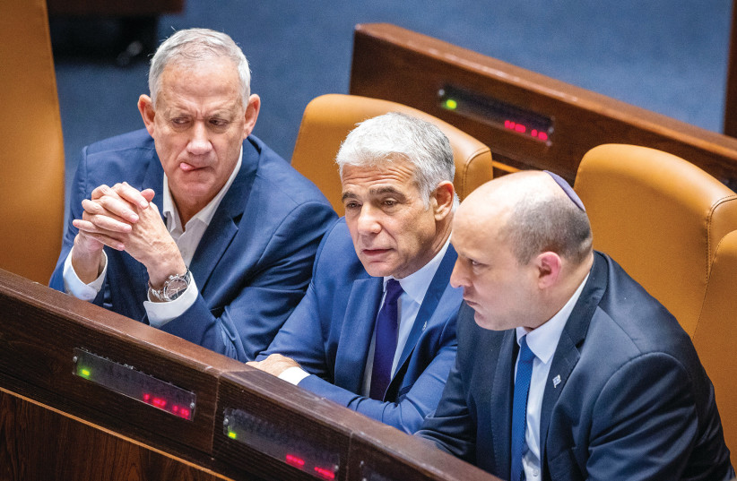  BENNY GANTZ, Yair Lapid and Naftali Bennett in the Knesset last month getting ready for elections.  (credit: OLIVIER FITOUSSI/FLASH90)