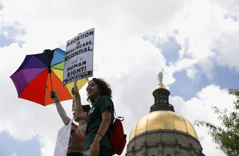  Abortion rights protesters participate in nationwide demonstrations following the leaked Supreme Court opinion suggesting the possibility of overturning the Roe v. Wade abortion rights decision, in Atlanta, Georgia, US, May 14, 2022.  (credit: REUTERS/ALYSSA POINTER)