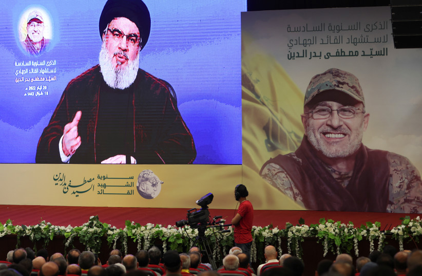  Lebanon's Hezbollah leader Sayyed Hassan Nasrallah addresses his supporters via a screen during a rally commemorating late Hezbollah commander Mustafa Badreddine who was killed in an attack in Syria, in Beirut suburbs, Lebanon May 20, 2022 (credit: REUTERS/AZIZ TAHER/FILE PHOTO)