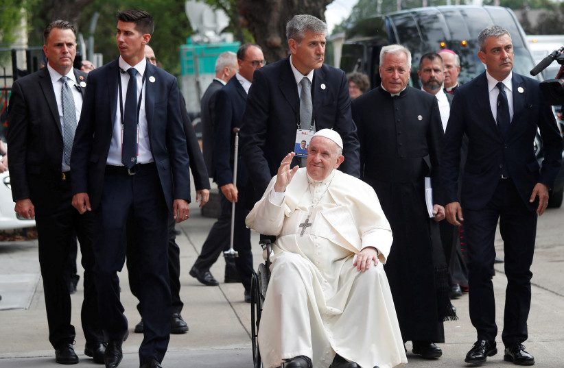Pope Francis waves at local residence outside the Sacred Heart Church of the First Peoples during his visit to Edmonton, Alberta, Canada July 25, 2022. (photo credit: REUTERS/Todd Korol)