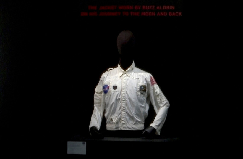  A general view of Buzz Aldrin's flown inflight coverall jacket, worn by him on his mission to the Moon and back during Apollo 11, that was sold for $2,772,500 at Sotheby's, in New York City, U.S. July 21, 2022 in this screengrab from a video. (credit: REUTERS TV/via REUTERS)