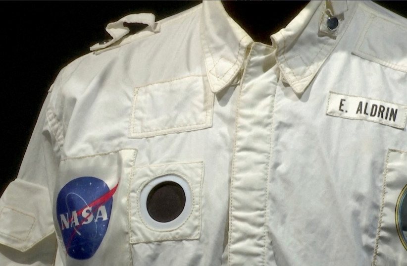  A view of a detail of Buzz Aldrin's flown inflight coverall jacket, worn by him on his mission to the Moon and back during Apollo 11, that was sold for $2,772,500 at Sotheby's, in New York City, U.S. July 21, 2022 in this screengrab from a video. (photo credit: REUTERS TV/via REUTERS)