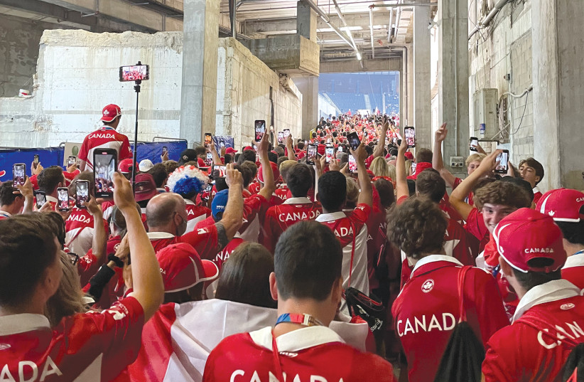  Team Canada marches into Teddy Stadium. (credit: ALDEN TABAC)