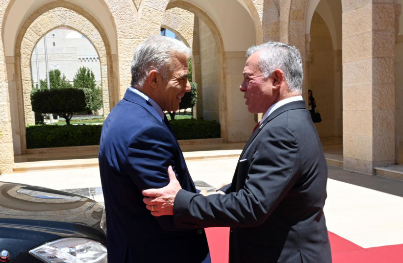  Prime Minister Yair Lapid meets with King Abdullah II of Jordan, July 27, 2022 (credit: CHAIM TZACH/GPO)
