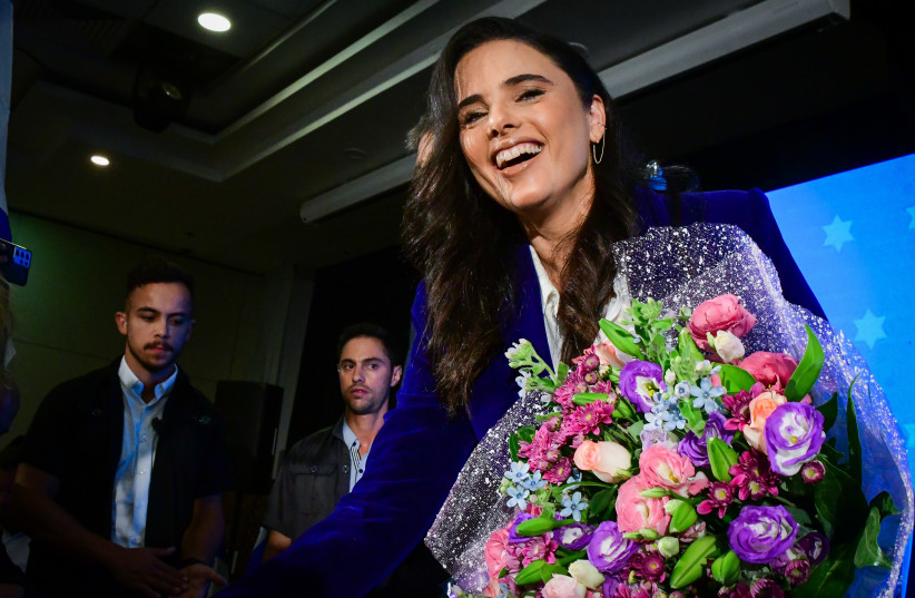  Interior Minister Ayelet Shaked was given flowers after annoucing a joint run with Communications Minister Yoaz Hendel as the Zionist Spirit party on July 27, 2022 (credit: AVSHALOM SASSONI/FLASH90)