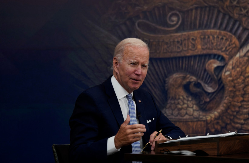  US President Joe Biden listens as he receives an update on economic conditions from his advisors in the Eisenhower Executive Office Building's South Court Auditorium at the White House in Washington, US, July 28, 2022.  (credit: REUTERS/ELIZABETH FRANTZ)