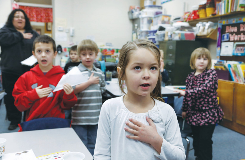  THE PLEDGE of Allegiance is recited in a first grade classroom in Kansas. (photo credit: JEFF TUTTLE/REUTERS)