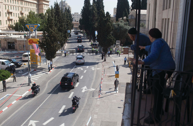  PEOPLE LOOK from their balcony as then-US president Barack Obama’s cars arrive at the King David Hotel in Jerusalem in 2013. It is a rather bizarre street, bearing in mind it is Jerusalem’s most prestigious lane, says the writer. (photo credit: YONATAN SINDEL/FLASH90)