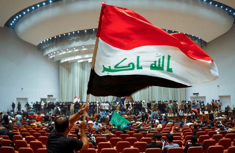  Supporters of Iraqi Shi'ite cleric Moqtada al-Sadr protest against corruption, inside the parliament in Baghdad, Iraq July 30, 2022. (credit: THAIER AL-SUDANI/REUTERS)