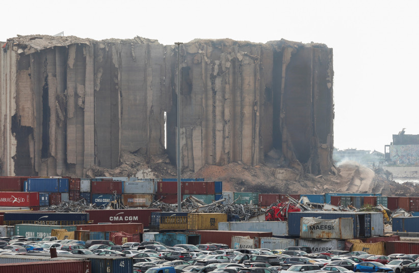  Dust rises as part of Beirut grain silos, damaged in the August 2020 port blast, collapses, in Beirut Lebanon July 31, 2022 (credit: REUTERS/MOHAMED AZAKIR)