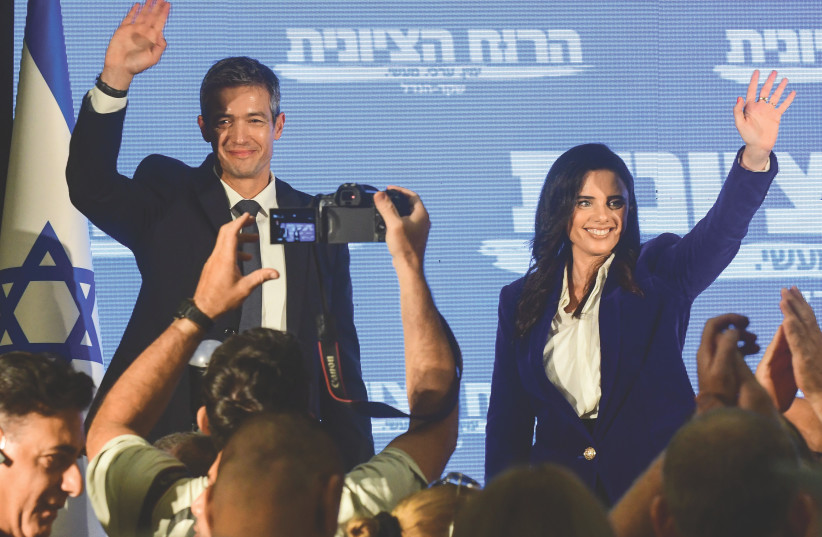  INTERIOR MINISTER Ayelet Shaked and Communications Minister Yoaz Hendel wave to supporters at a gathering in Ramat Gan, last Wednesday, as they announce they will run together as a new party in the upcoming Knesset election (credit: AVSHALOM SASSONI/FLASH90)