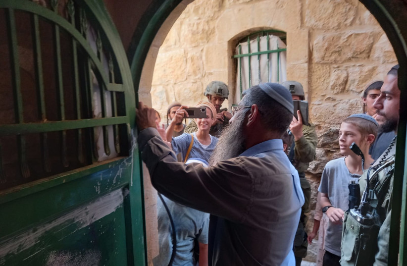  Israeli settlers announced their purchase of a three-story Palestinian building in Hebron near the Tomb of the Patriarchs, Sunday July 31, 2022 (photo credit: HARCHIVI)