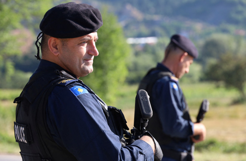  Kosovo police patrol a road in Zupce, Kosovo August 1, 2022.  (photo credit: REUTERS/FATOS BYTYCI)