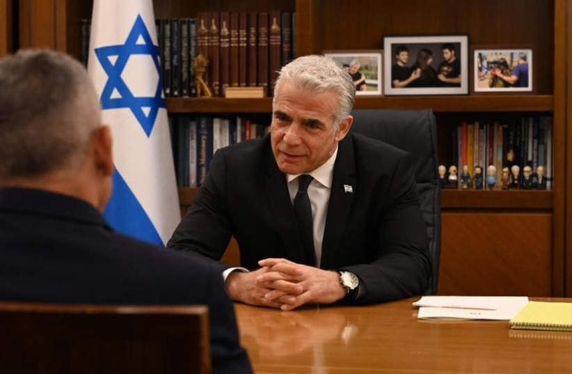  Prime Minister Yair Lapid with Moshe Edri, incoming head of Israel's Atomic Energy Commission (credit: CHAIM TZACH/GPO)