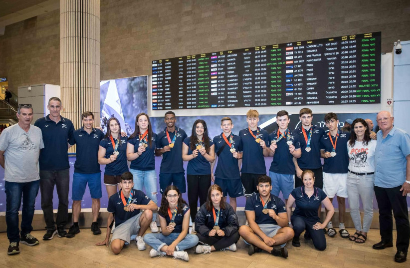 The Israeli Olympic delegation medalists upon their arrival at Ben Gurion Airport, August 1, 2022. (photo credit: The Olympic Committee of Israel / Courtesy)
