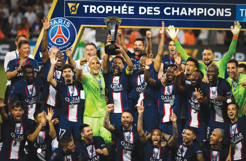  PARIS SAINT-GERMAIN celebrates with its trophy after winning the French Super Cup match against Nantes at Bloomfield Stadium in Tel Aviv, Sunday night (photo credit: OREN BEN HAKOON/FLASH90)
