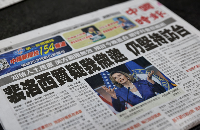  A newspaper front page reporting about U.S. House of Representatives Speaker Nancy Pelosi is pictured in Taipei, Taiwan, August 2, 2022. (photo credit: REUTERS/ANN WANG)