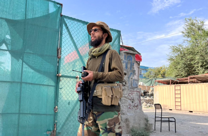  A Taliban fighter stands guard near the site where Al Qaeda leader Ayman al-Zawahiri was killed in a US strike over the weekend, in Kabul, Afghanistan, August 2, 2022. (credit: REUTERS/STRINGER)