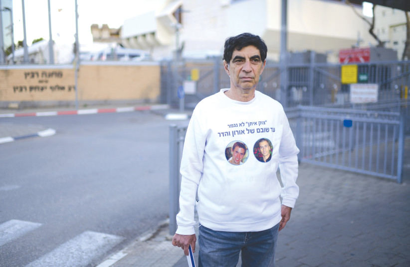  SIMCHA GOLDIN, father of late IDF soldier Hadar Goldin, stands outside IDF headquarters in Tel Aviv, continuing the campaign for the return of the remains of his son and comrade, Oron Shaul. (photo credit: TOMER NEUBERG/FLASH90)