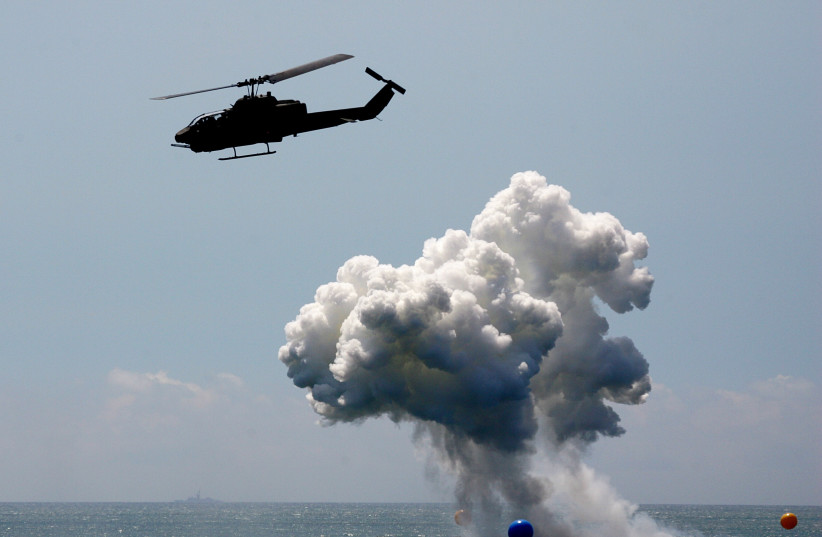  A US-made AH-1W Cobra helicopter launches hellfire missiles during the annual Han Kuang No. 22 Military Exercise in Ilan county, 80 km. west of Taipei, on July 20, 2006 (photo credit: REUTERS/RICHARD CHUNG)