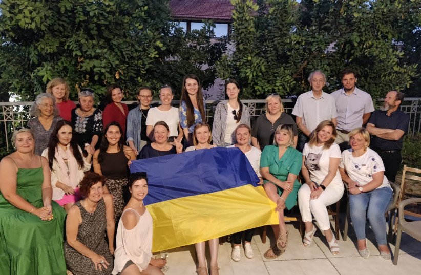  PARTICIPANTS HOLD the Ukrainian flag; Prof. Danny Brom at 3rd R.  (photo credit: Metiv – the Israel Psychotrauma Center)